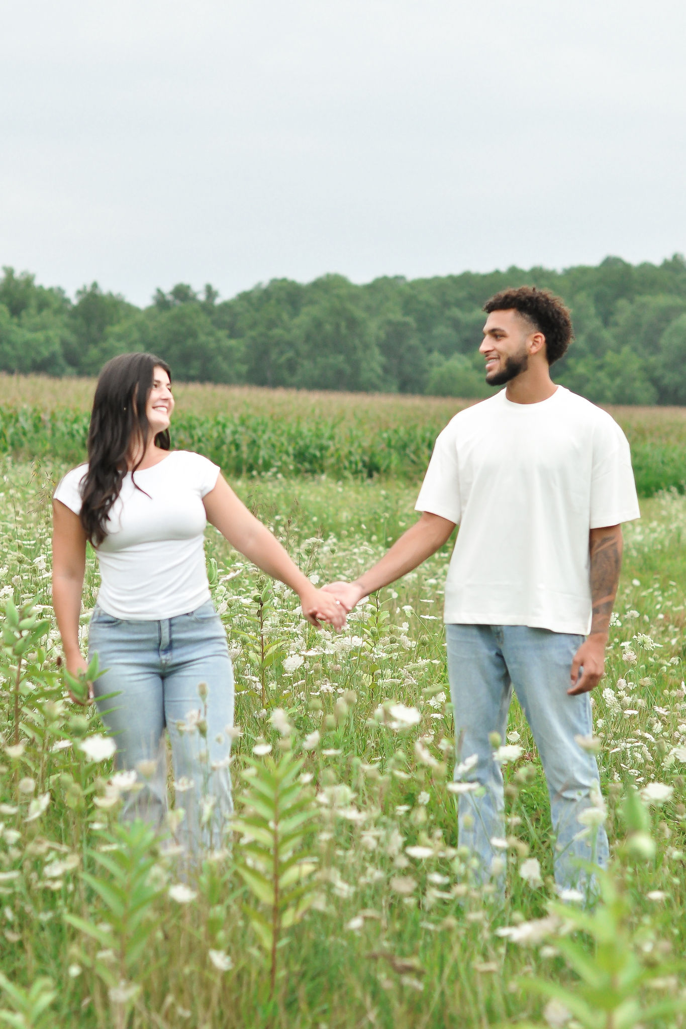 Ellie and Jaiden walking toward each other in a field