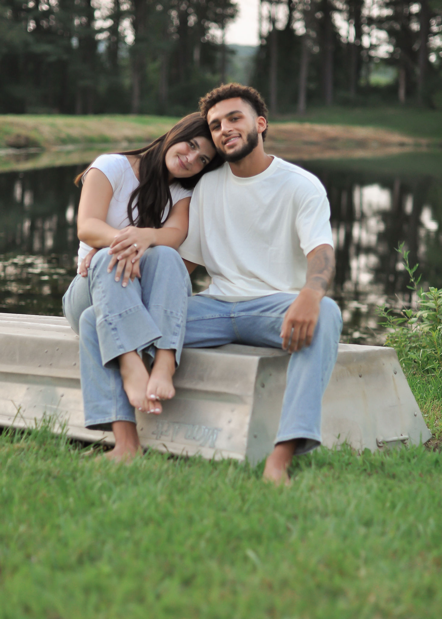 Ellie and Jaiden sitting together by the pond